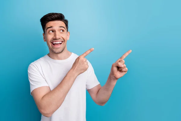 Photo Excited Dreamy Man Dressed White Shirt Pointing Two Fingers — Stock Photo, Image