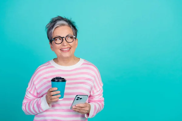 stock image Photo of sweet adorable woman dressed pink pullover enjoying tea typing gadget looking empty space isolated teal color background.