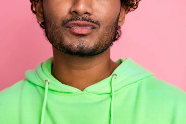 Close up cropped photo of funny boyfriend indian man pouty lips sending you a kiss lover flirting isolated on pink color background.
