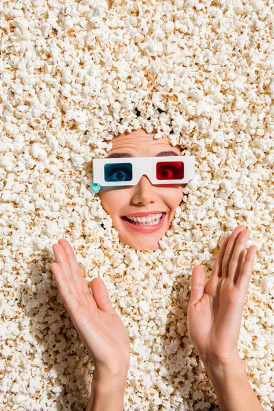 Vertical above view photo of positive cheerful lady toothy smile watch movie 3d glasses arms clapping face isolated on popcorn background.