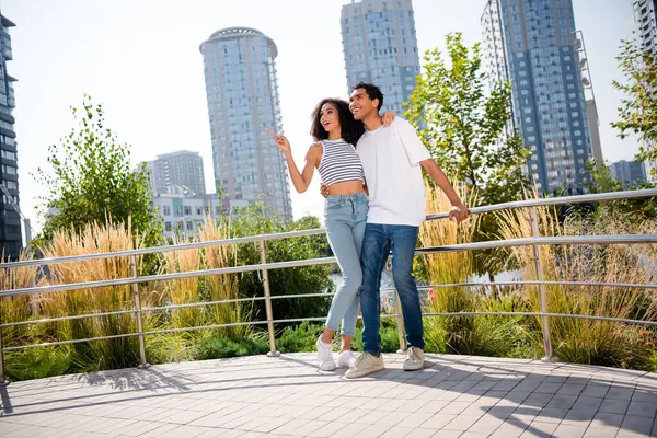 stock image Photo of dreamy sweet married couple dressed casual outfits embracing enjoying sightseeing together outdoors urban city park.