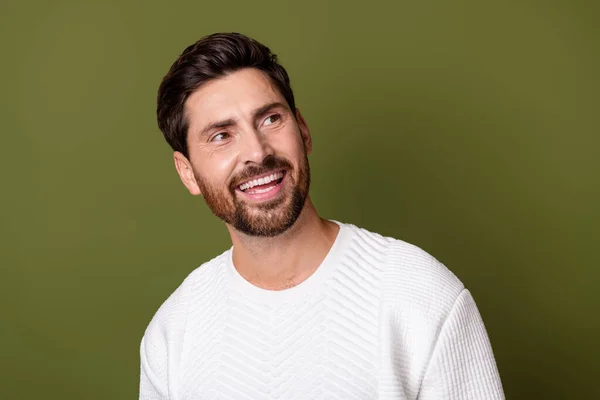 Stock image Photo of cheerful gentleman dressed white sweater look up poster news empty space isolated on khaki color background.