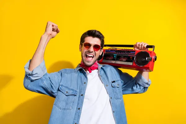 Photo Ecstatic Guy Wear Jeans Jacket Glasses Boombox Shoulder Celebrate — Stock Photo, Image