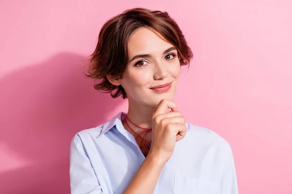 Portrait of clever positive minded girl hand touch chin contemplate decide isolated on pink color background.