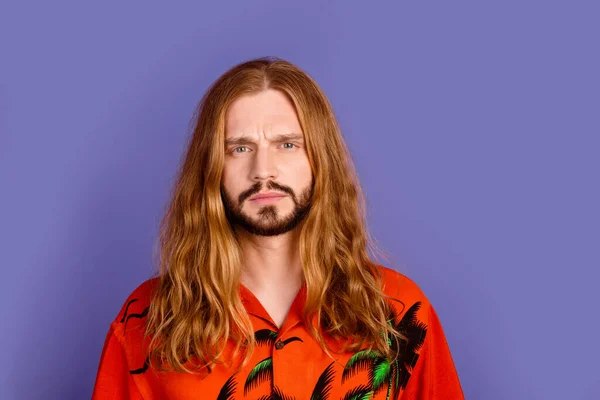 Photo of serious brutal cool person with beard long hairstyle dressed print shirt staring at you isolated on violet color background.