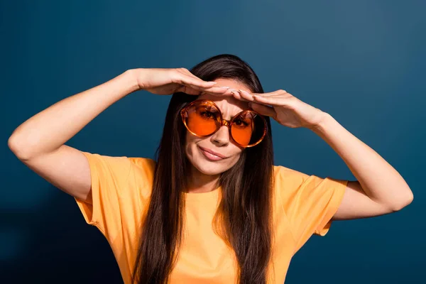 Portrait of confused funny woman wear stylish t-shirt in sunglass palm on forehead hiding from sun isolated on dark blue color background.
