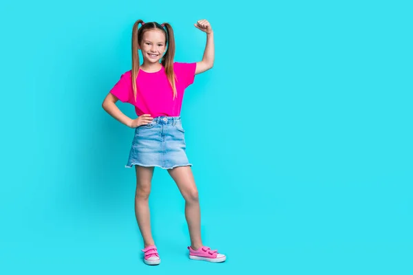 Photo of strong active girl sportswoman dressed trendy clothes showing muscles triceps empty space isolated on cyan color background.