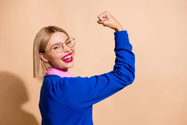 Profile photo strength women rights raise fist up celebrating her justice promotion in business company isolated on beige color background.