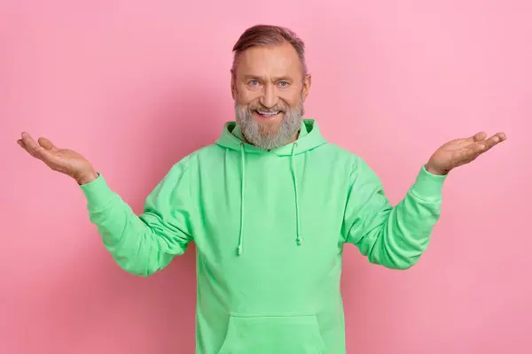 Photo Cheerful Positive Man Wear Green Sweatshirt Comparing Arms Empty — Stock Photo, Image