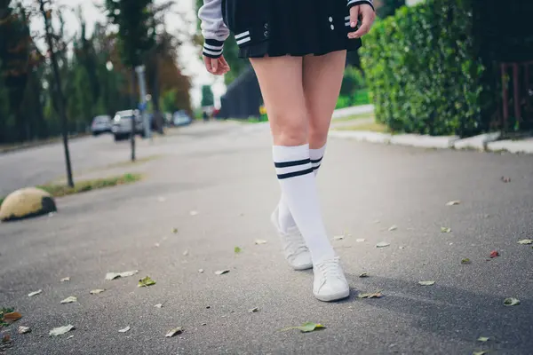 Photo portrait of charming teenager woman walking legs schoolgirl wear trendy uniform clothes nature green park background.