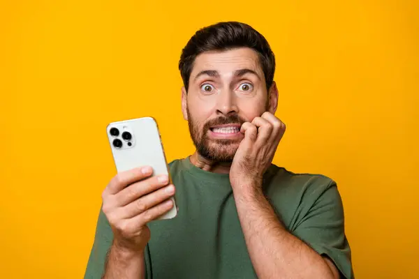 Photo Portrait Nice Young Male Hold Gadget Bite Nails Frightened — Stock Photo, Image