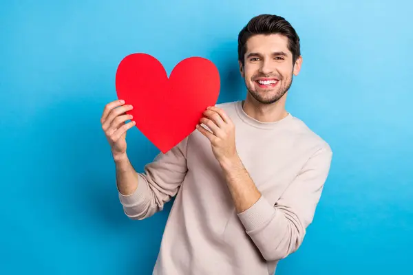 Photo Nice Young Man Hold Heart Shape Card Wear Beige — Stock Photo, Image
