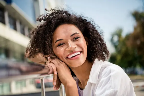 stock image Photo of cheerful lovely woman tourist exploring new city walking traveling alone enjoying modern architecture beautiful moments outside.