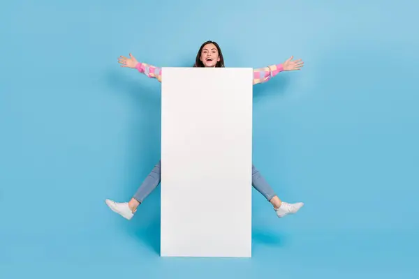 stock image Full body photo of young pretty lady good mood jump up ads promoter isolated over blue color background.