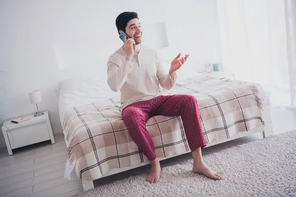 Photo Positive Attractive Man Speaking Phone Weekend Morning Cozy Apartment Stock Picture
