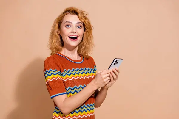 Portrait Ecstatic Girl Wavy Hairdo Wear Shirt Hold Smartphone Impressed Stock Picture