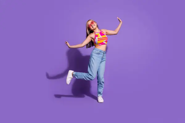 Photo of crazy cool positive girl wear stylish clothes enjoy dance night club isolated on purple color background.