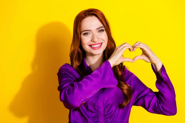 stock image Photo portrait of attractive young woman hands heart gesture dressed stylish violet clothes isolated on yellow color background.