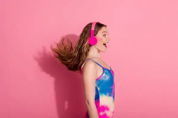 stock image Photo of adorable lovely girl wear retro outfit earphones singing empty space isolated pink color background.