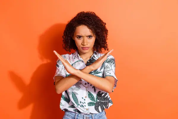 stock image Photo portrait of funky young positive girl with curly hair in hawaiian shirt crossed hands stops you isolated on orange color background.