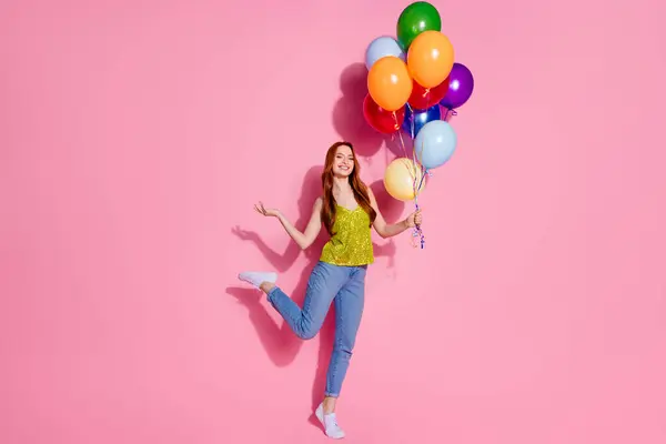 stock image Full size photo of pretty young woman hold balloons wear shiny top isolated on pink color background.