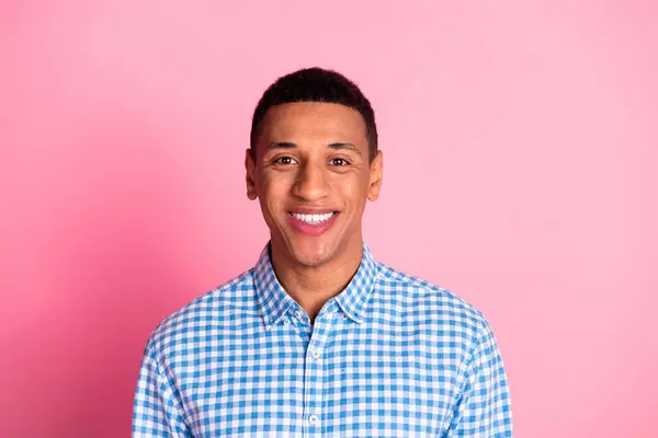 stock image Photo of attractive confident guy wear plaid shirt smiling emtpy space isolated pink color background.