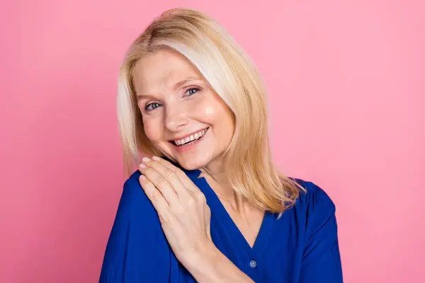 stock image Photo portrait of attractive retired woman hug self touch shoulder dressed stylish blue clothes isolated on pink color background.