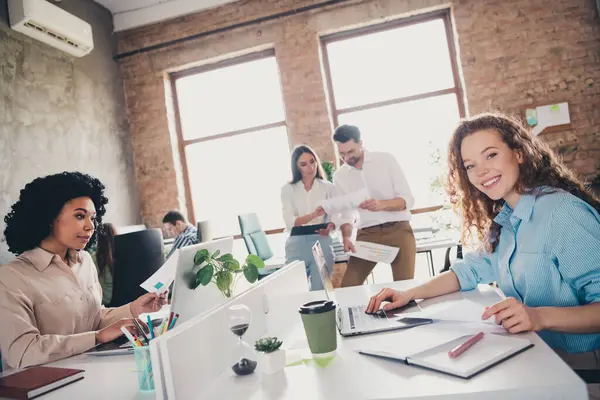 stock image Photo of smiling good mood teamwork young people working together employees modern industrial open space style interior workstation.