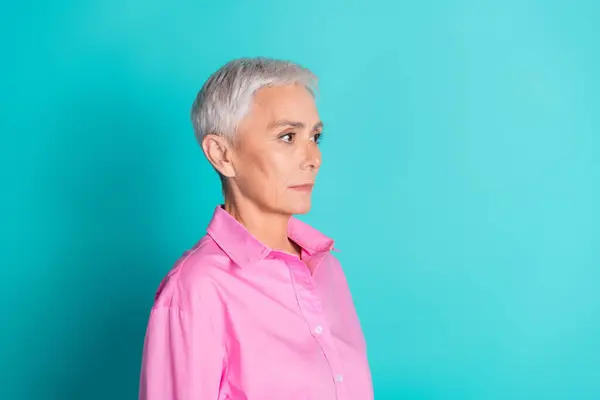 stock image Profile portrait of pretty aged lady look empty space wear pink shirt isolated on turquoise color background.