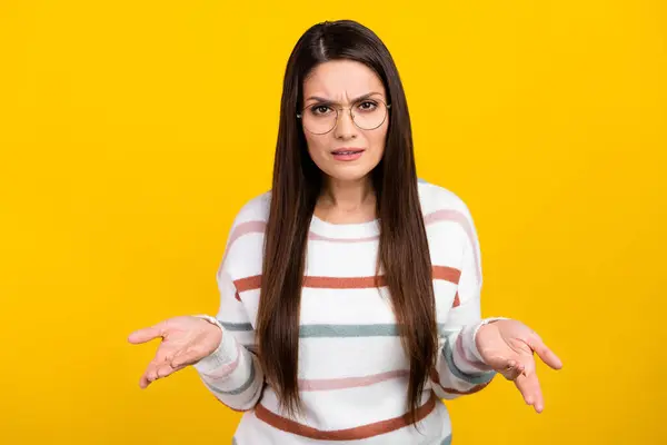 stock image Portrait photo of confused businesswoman in eyeglasses shrugging shoulders questioned about her money isolated on yellow color background.