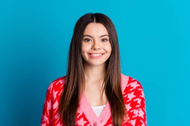 Photo of good mood nice woman with straight hairstyle dressed knitwear cardigan smiling at camera isolated on blue color background. clipart