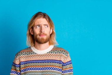 Portrait of nice young man look empty space wear sweater isolated on turquoise color background. clipart