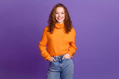 Portrait of nice young girl posing wear pullover isolated on purple color background. clipart