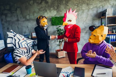 Portrait of gorilla zebra mask business people applaud rooster lion handshake loft business center indoors. clipart