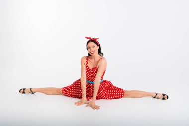 Photo of active cheerful woman learning cha cha dance in ballroom studio school sit twine isolated on white color background. clipart