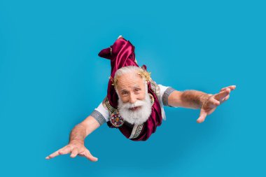 Photo of crazy funny man rome emperor ancient antique philosopher fly air isolated on blue color background. clipart