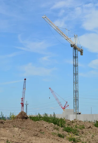 Three mobile construction crane at future development
