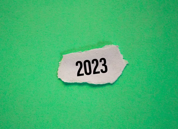 2023 written on paper piece. New year 2023 concept background photo. New year new beginnings.