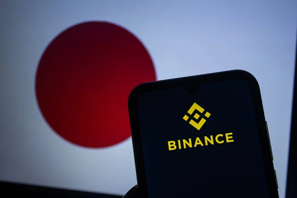 Логотип Binance Отображается Экране Смартфона Размытый Флаг Японии Заднем Плане — стоковое фото