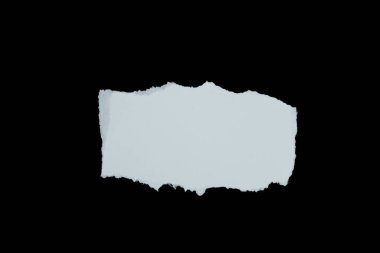 Blank torn paper isolated on black background. Top view of white paper piece with copy space.