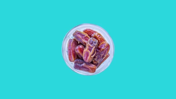 Bowl Date Fruits Rotating Blue Background Traditional Ramadan Food Muslims — Stock videók