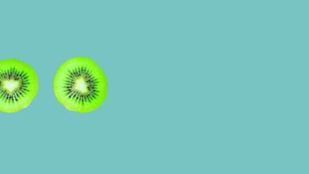 Kiwi Slices Rotating Blue Background Healthy Eating Concept — Video