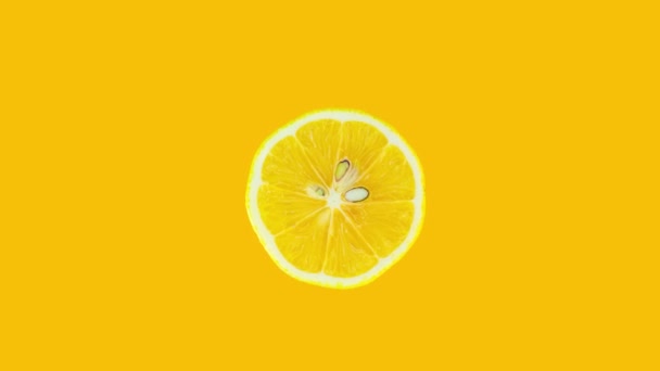 Lemon Slice Rotating Yellow Background Stop Motion Citrus Animation Healthy — Stockvideo