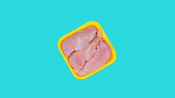 Raw Chicken Meat Rotating Blue Background Top View Footage Uncooked — Stock videók