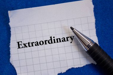 Extraordinary word written on torn paper.