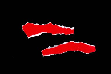 Red torn paper pieces isolated on black background