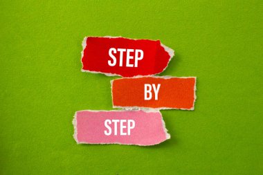 Step By Step written on paper. Business concept photo.
