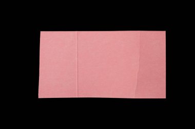 Pink cardboard piece isolated on black background