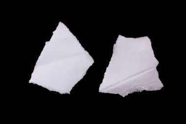 Torn paper piece isolated on black background. Ripped paper with copy space for text.