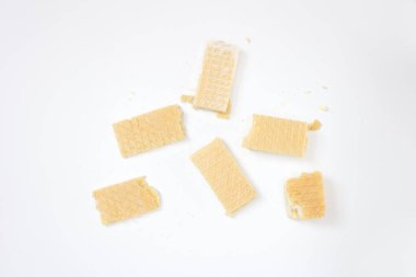Wafer pieces isolated on white background. Top view, flat lay.